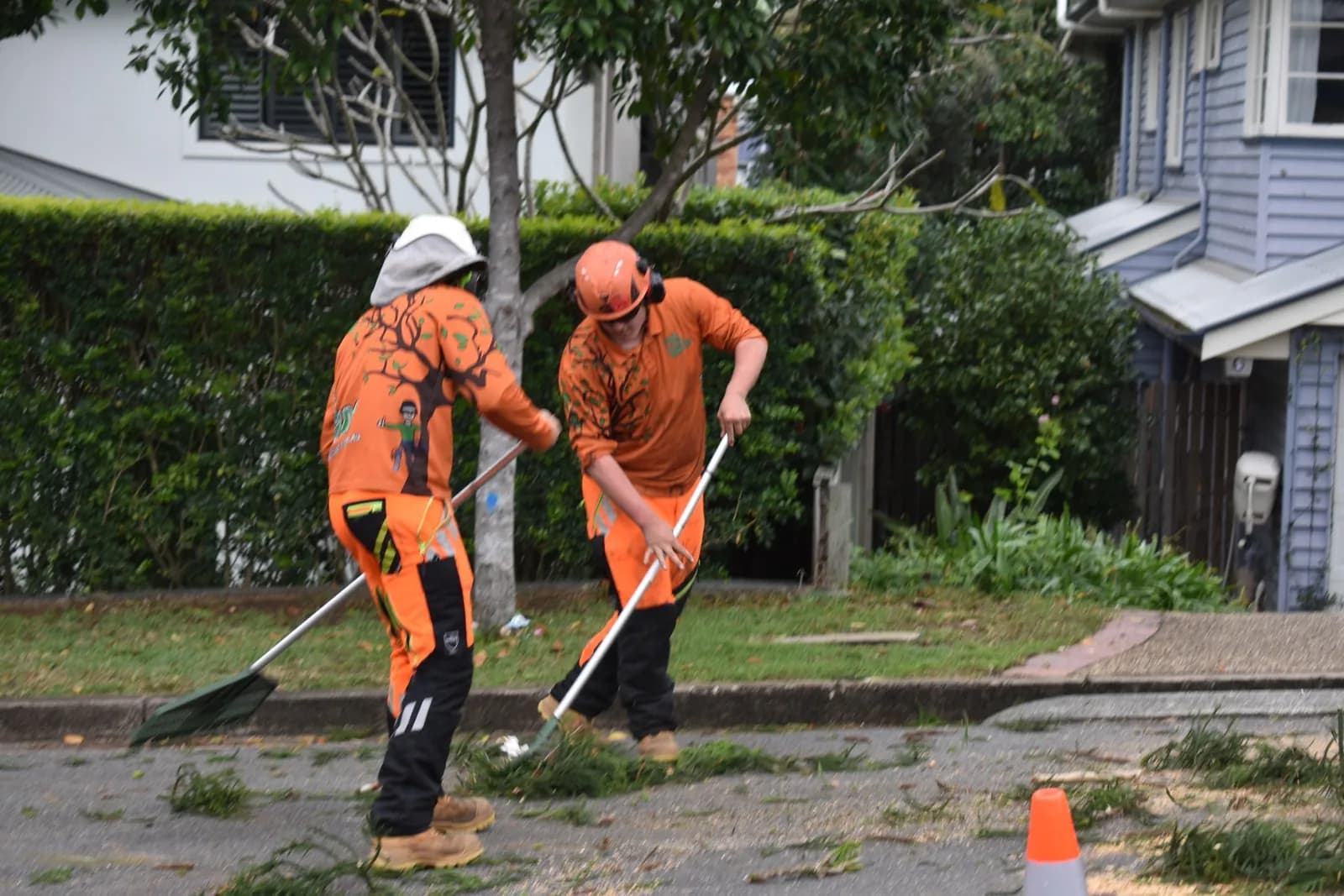 Raking the lawn clean once the timber is out