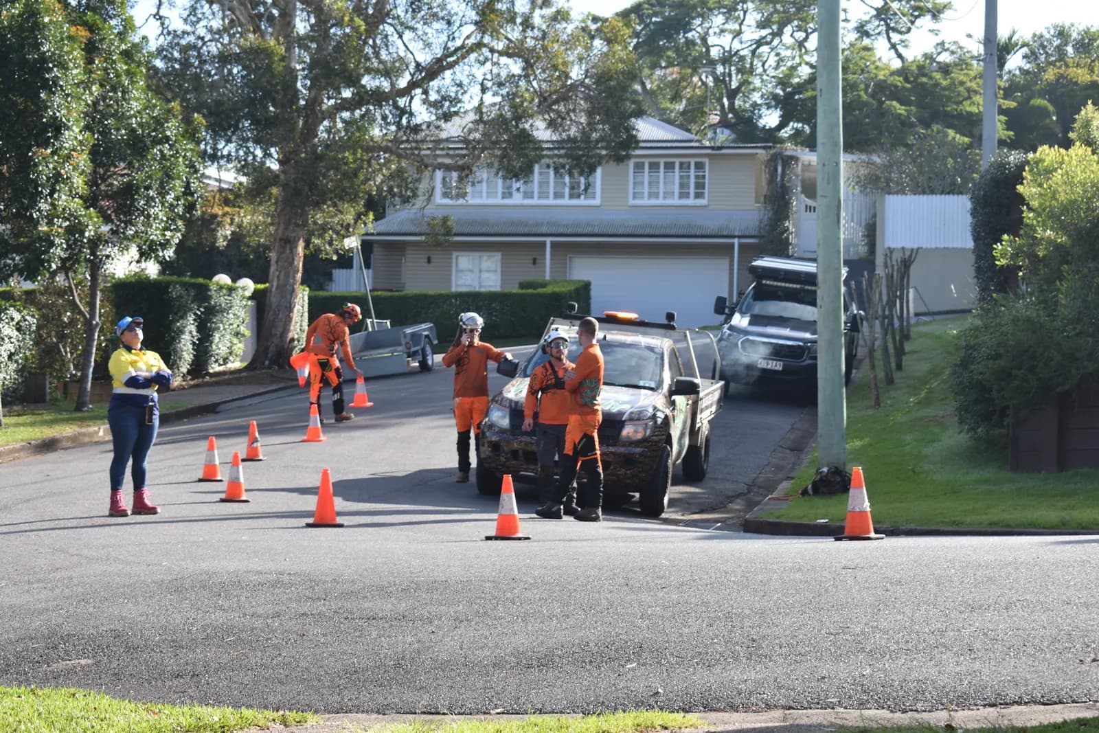 The crew setting up traffic management on a suburban Brisbane street