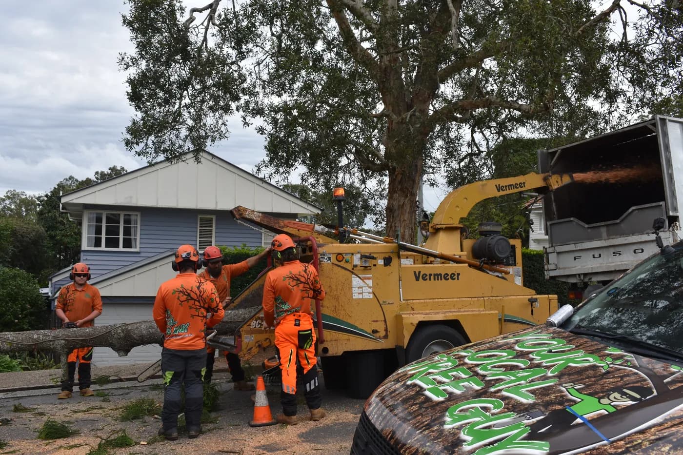 Brush going through the chipper on a residential street