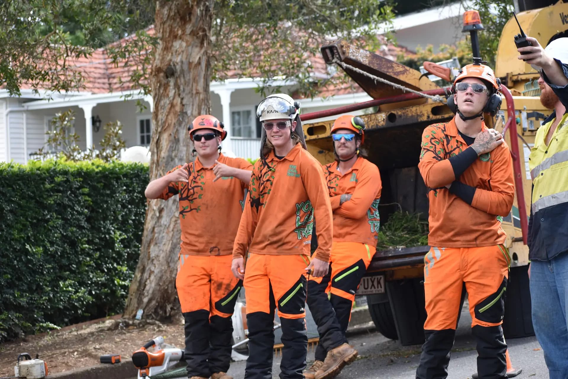The Your Local Tree Guy crew together at the truck on a Brisbane job