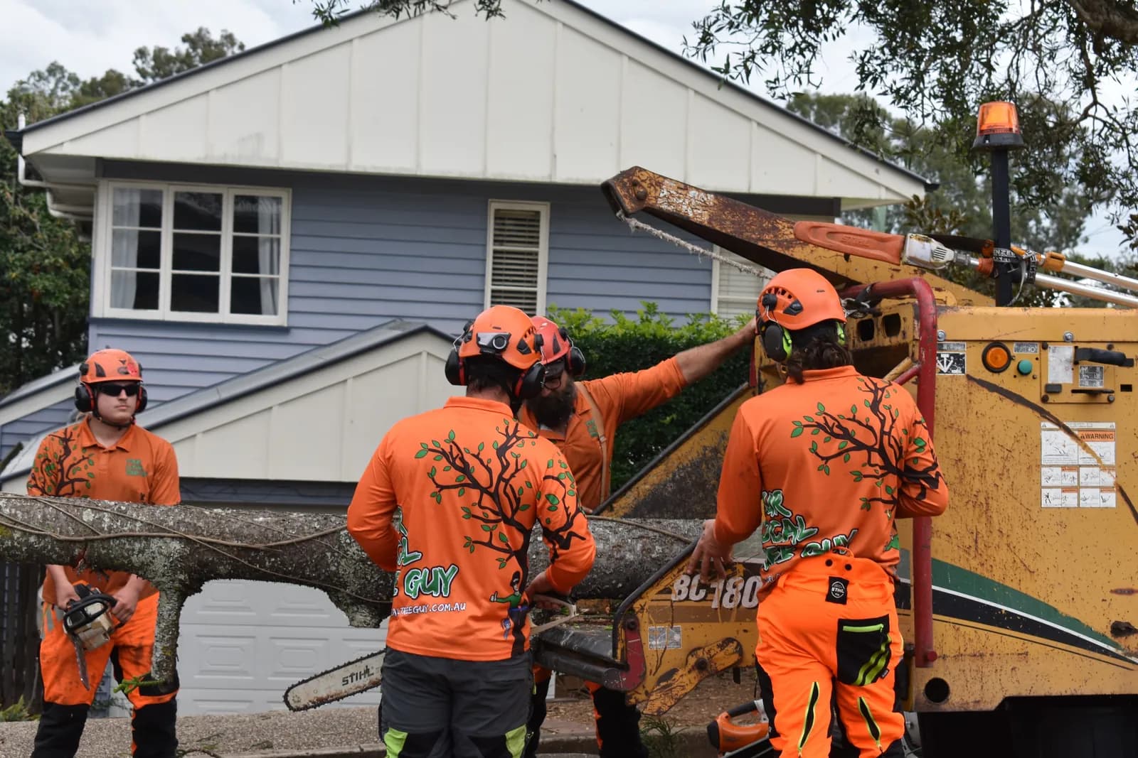 Loading the last of the brush into the chipper